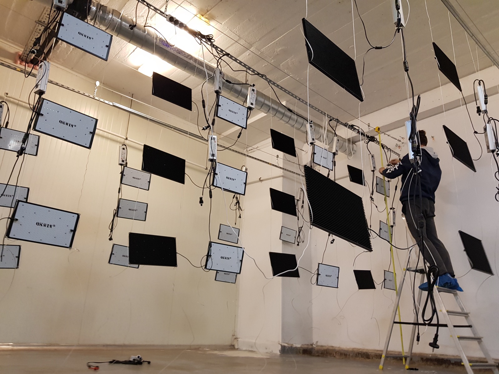 Day 1 — LED driver wall installation, person on ladder wiring fixtures